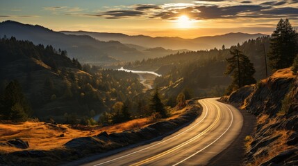 Top view of mountain road in forest at sunset