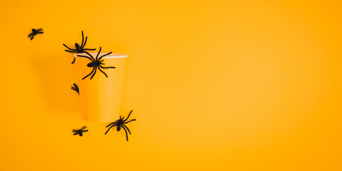 Halloween decorations concept. Halloween with spiders on orange background. Flat lay, top view, copy space