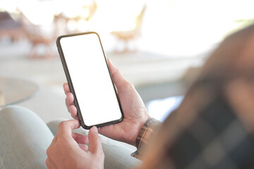 cell phone blank white screen mockup.hand holding texting using mobile on desk at office.background empty space for advertise.work people contact marketing business,technology