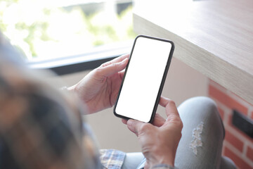 cell phone blank white screen mockup.hand holding texting using mobile on desk at office.background empty space for advertise.work people contact marketing business,technology