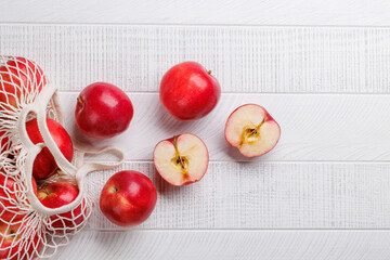 Mesh bag with fresh red apples