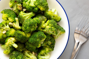 Homemade Pan-fried Broccoli on a Plate on a gray background, top view.