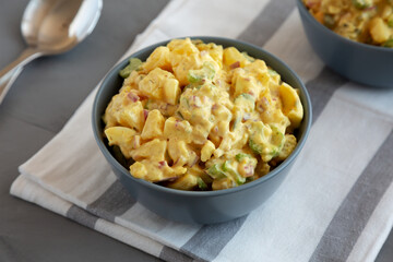 Homemade Classic Potato Salad in Bowls, side view.