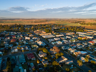 Morning sunlight at sunrise on building rooftops in small town
