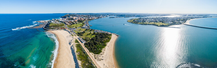 Blue sunlit water where the Hunter River meets the sea in the Newcastle Harbour