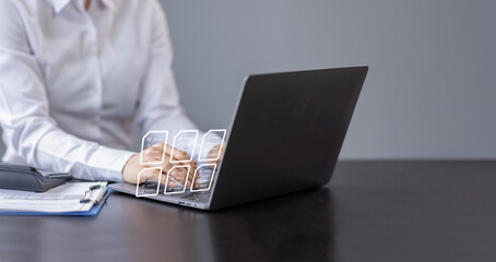 Document management concept with icons on virtual screen, ERP, Businessman working on laptop computer keyboard with electronics document	