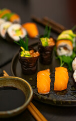 Luxurious and creative Sushi as Nigiri,Futomaki,Gunkan with chopsticks and Soja