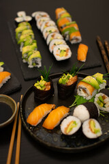 Luxurious and creative Sushi as Nigiri,Futomaki,Uramaki with chopsticks and Soja