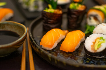 Luxurious and creative Sushi as Nigiri,Futomaki,Uramaki with chopsticks and Soja
