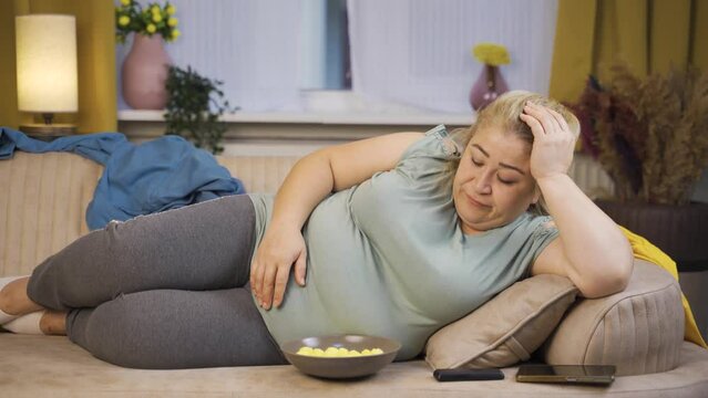 Lazy obesity woman napping at home.
