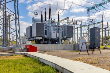 high voltage substation on a blue sky background with switches and disconnectors.