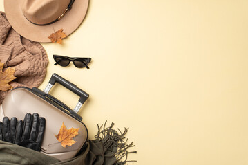 Bohemian fall escape: Overhead shot of boho-chic autumn fashion with a floppy hat, sunglasses,...