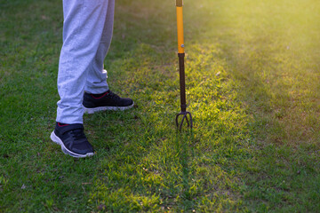 Dig up the ground on the garden plot. A manual device for loosening the earth.