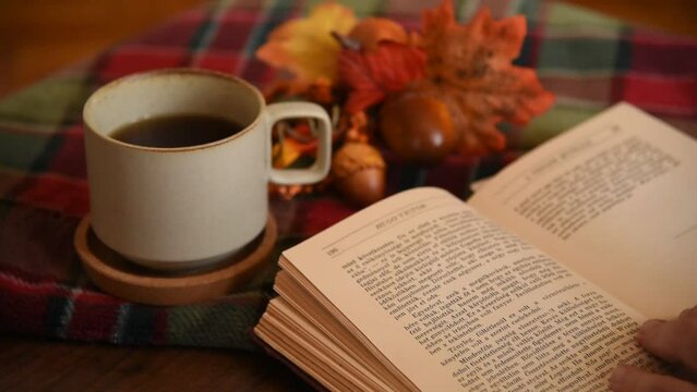 Book with a morning coffee with cozy autumn decorations fall vibe