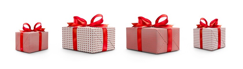 A collection of white and red gift wrapped Christmas presents with red ribbon bows isolated against...