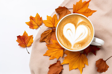 Pumpkin spice latte with a heart-shaped foam