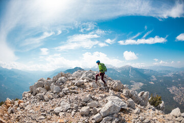 climber goes along the rocky ridge. girl climbing in the mountains. Turkey. the concept of...