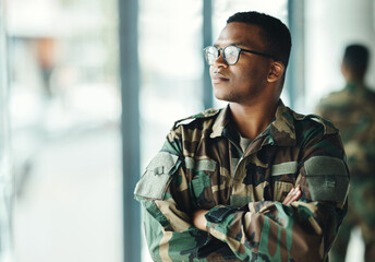 Confident soldier thinking, mockup and arms crossed in army building, pride and professional hero...