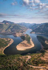 Panoramic sunset view with one of most picturesque meander of Arda river near Kardzhali, Rodopi Mountains in Bulgaria - 646839227
