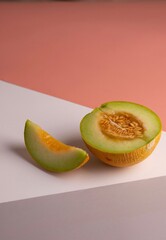 Creative photo of a melon on colorful background. Copy space. 