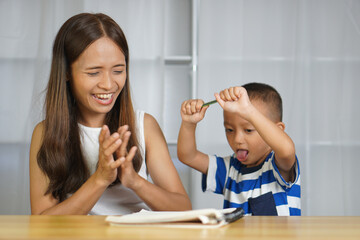 Mother and Luk are happy. Practice writing messages correctly - obrazy, fototapety, plakaty