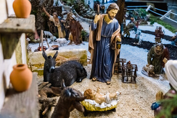 Figures of a classic nativity scene decorated with beautiful artistic traditional colors.