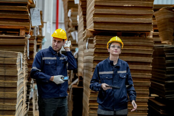 Warehouse workers checking the inventory. Products on inventory shelves storage. Worker Doing Inventory in Warehouse. Dispatcher in uniform making inventory in storehouse. supply chain concept	
