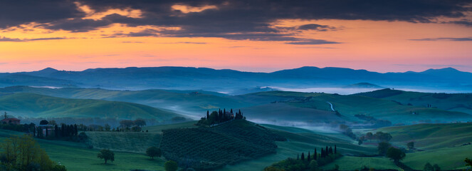 Wide banner panorama of the famous Podere Belvedere in Tuscany at sunrise - obrazy, fototapety, plakaty