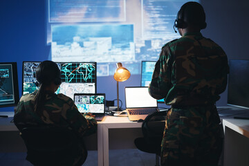 Control room, military and people on computer for surveillance, tracking operation and national security. Army, government and soldiers online for cybersecurity, communication network and monitoring