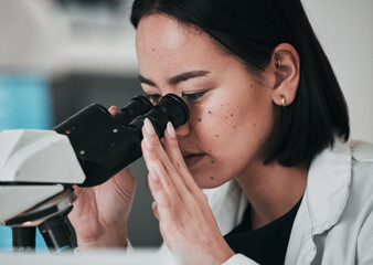 Science, microscope and Asian woman in laboratory for sample, data analysis and study. Biotechnology, healthcare and scientist looking in equipment for medical innovation, research and DNA testing