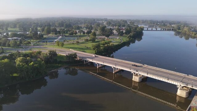 A morning aerial view of Frank N. Andersen Celebration Park near downtown Saginaw, Michigan on a late foggy summer morning. Frank N Andersen Bridge in the foreground.  	