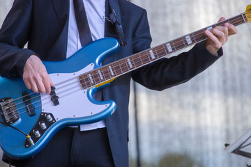 a musician plays an electric guitar on a stage