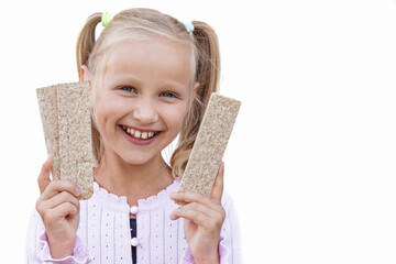 Whole Grain Crisps in Child Hands Isolated on White Background. Crunchy Rye Crispbreads for Kids. Healthy Food Bars for Children.  