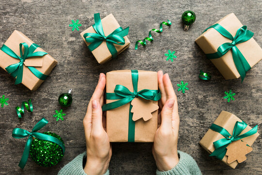 Woman Hands Holding Gift Box, Preparing Surprise For Holiday, Top View, Christmas And New Year Concept