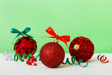Christmas ball on colored background. decoration bauble with ribbon bow with copy space