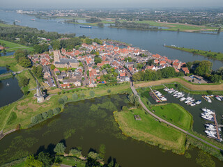 Obraz premium Aerial from the historical city Woudrichem at the river Merwede in the Netherlands