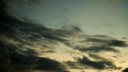 The sky is overcast. Clouds are forming and rain is falling.