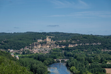 Fototapeta na wymiar Aerial view of the River Dordogne, Ch?teau de Beynac (a fortified clifftop castle) and the Beynac-et-Cazenac village classified as one of the most beautiful villages of France in summer