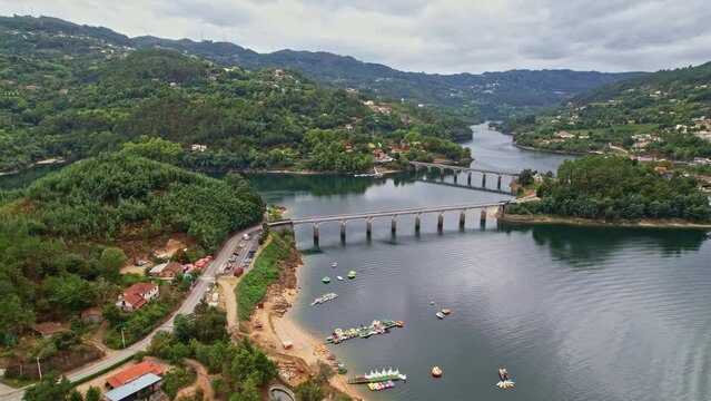 A beautiful Aerial view of a bridge over the Cavado River in Peneda-Geres National Park, Portugal