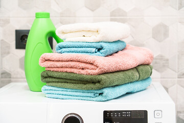 Clean towels and detergent in the laundry or bathroom.