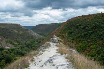 A path leading to three very high mountains