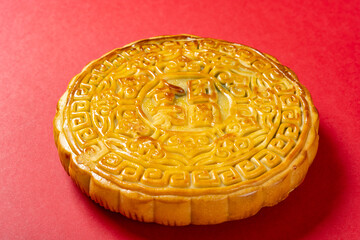 angle view big size of traditional Chinese mooncake on red translation of the Chinese is family reunion