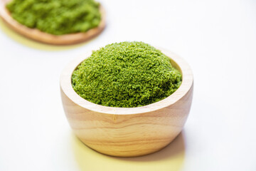 Wolffia globosa in wooden bowl. Wolffia is the nutrient-rich plant-based source of protein and omega3 and vital minerals like zinc, calcium, iron, B12 and so much more.