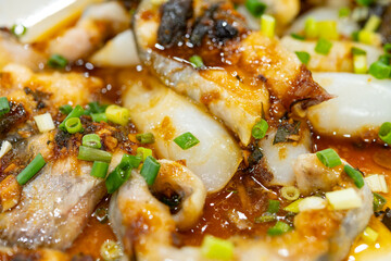 angle view fresh steamed fish slices on a dish