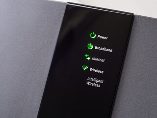 A close -up of an Internet router hub box display panel. Showing power, broadband, internet,...