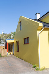 Colorful side of a yellow building in downtown Reykjavik Iceland