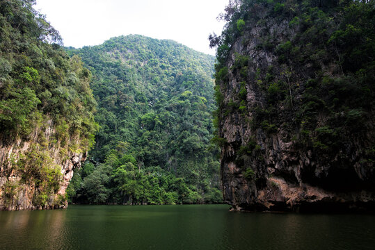 Tasik Cermin or Mirror Lake, Ipoh, Malaysia. Tasik Cermin, or Mirror Lake, is a stunning hidden lake surrounded by limestone karst towers. Located near Ipoh town, Perak state, Malaysia.