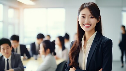 Fototapeta premium A confident businesswoman leads a successful team in a corporate office, smiling and standing alongside her colleagues, reflecting professionalism, teamwork, and a positive work environment