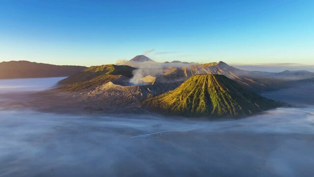 Aerial view of Mount Bromo volcano (Gunung Bromo) during sunrise in Bromo Tengger Semeru National Park, East Java, Indonesia.