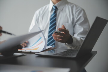 Financial Business woman analyze the graph of the company's performance to create profits and growth, Market research reports and income statistics, data,repotr,Financial and Accounting concept.